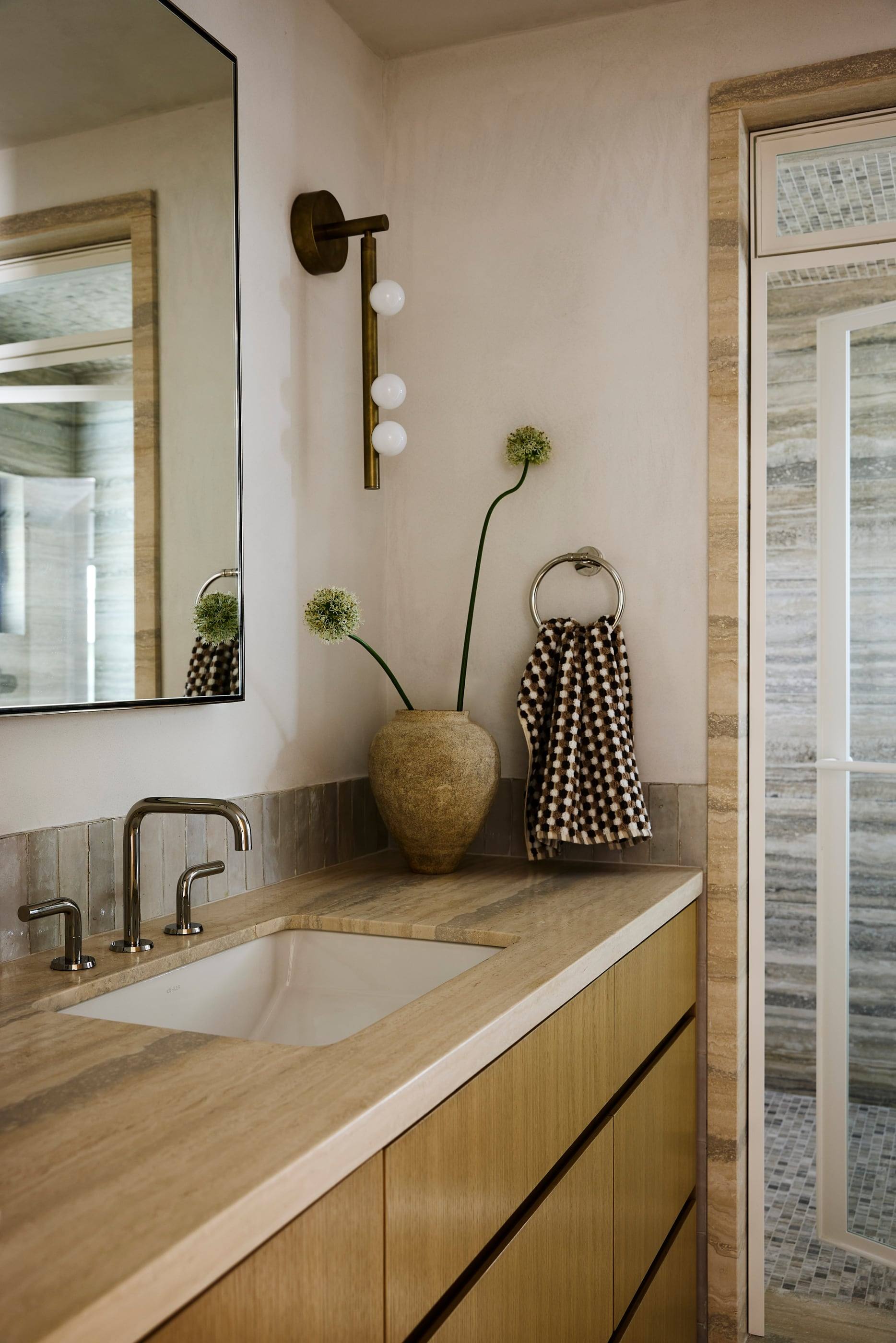 Bath with a travertine counter