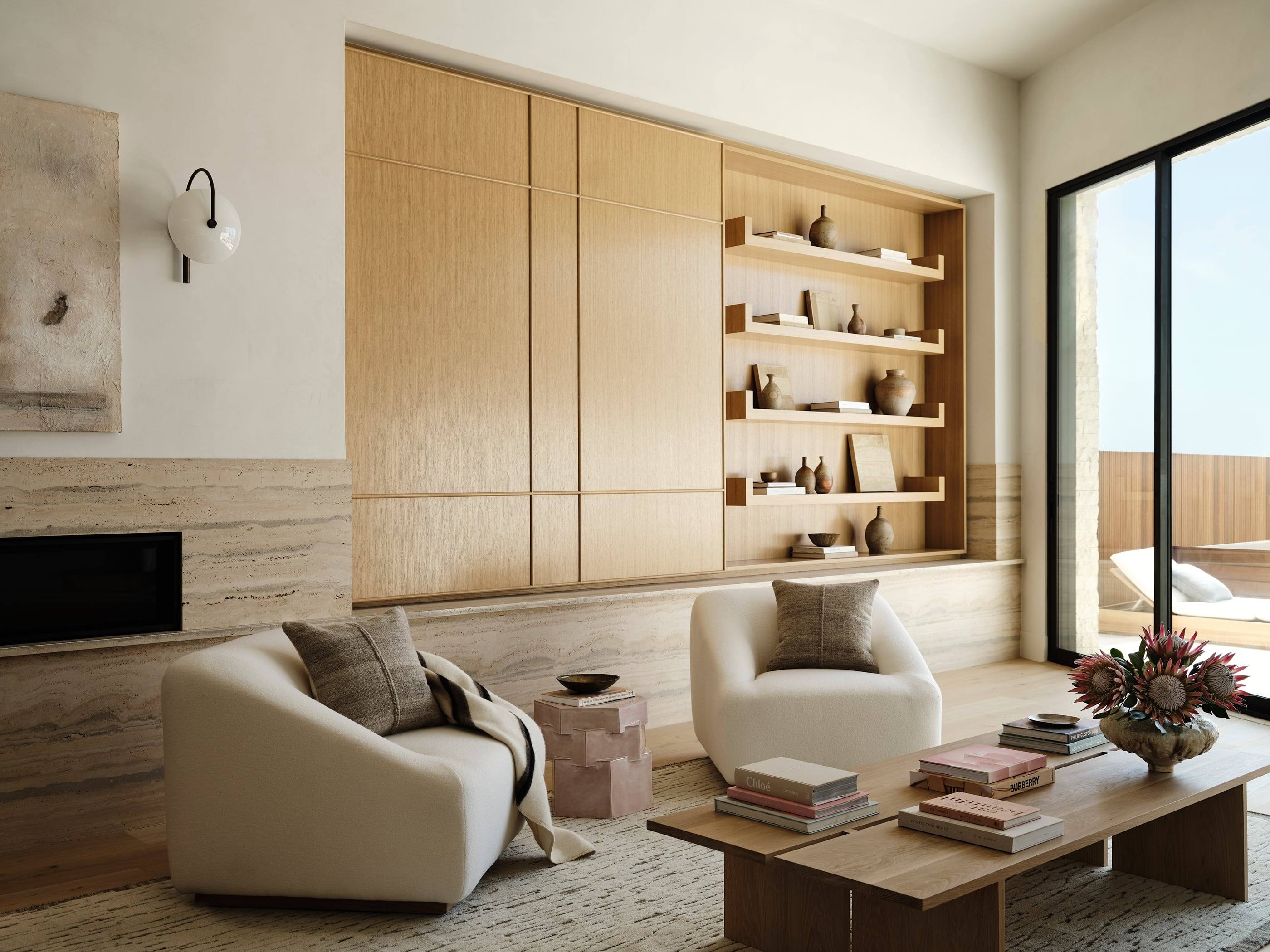 Living room with a travertine fireplace wall
