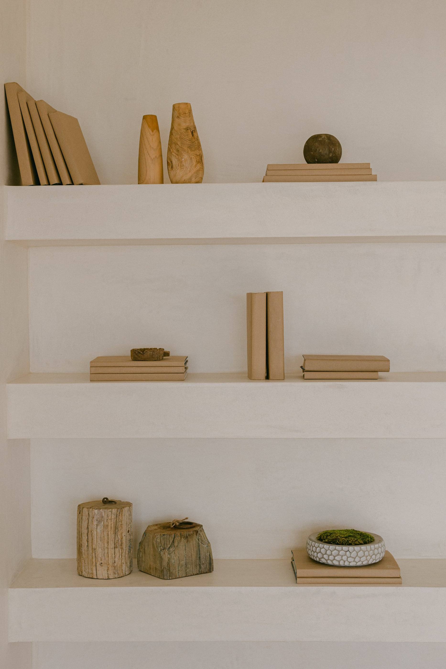 Plaster shelving styled with books