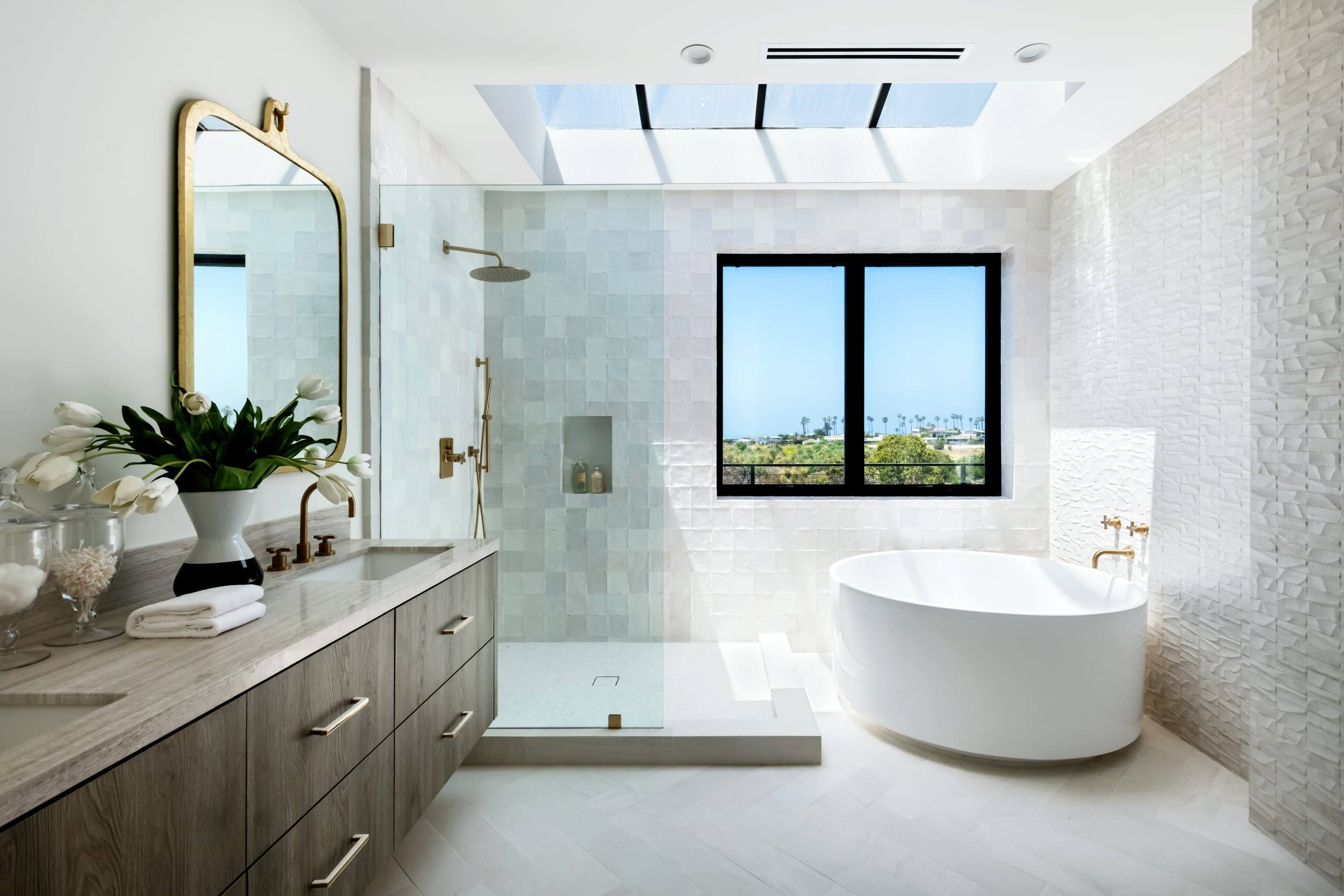 Primary bath with a brass mirror